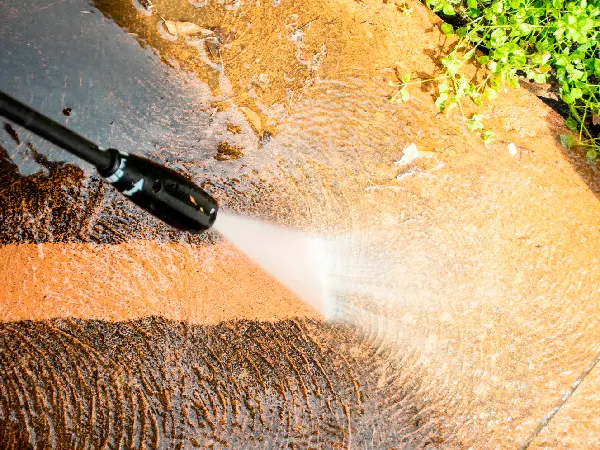 Cleaning backyard with pressure washer clelaner. Spring clean up